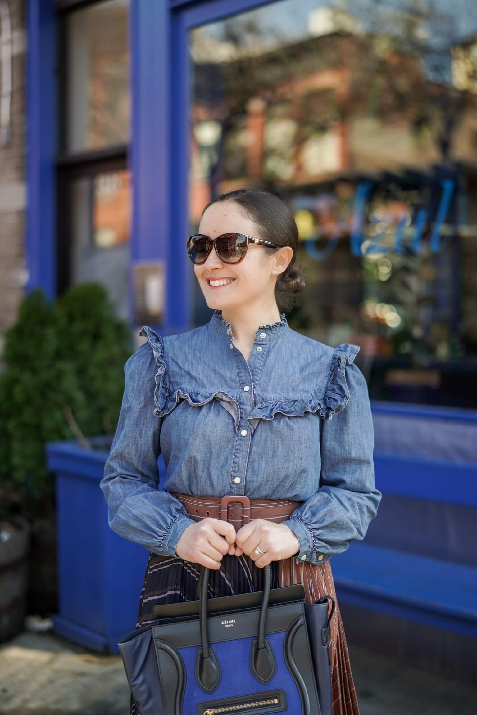 Anthropologie Pleated Skirt Veronica Beard Denim Shirt Coclico Booties Celine Luggage Bag Outfit by Modnitsa Styling